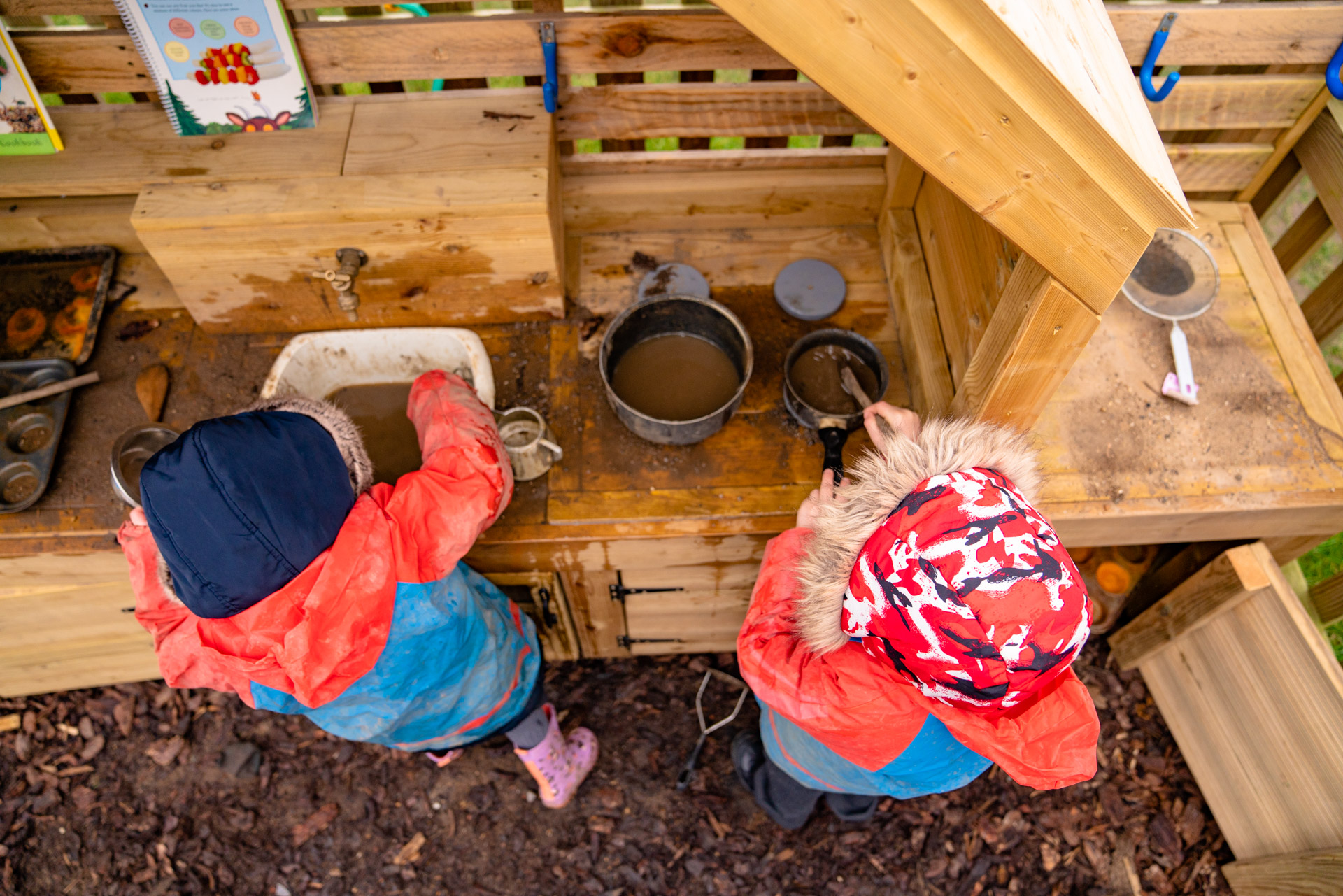 A photograph of two children playing outdoors.